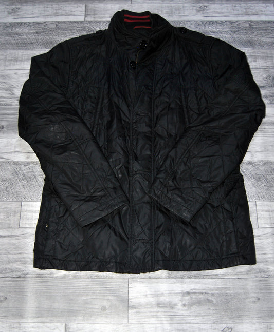 Abrigo Hugo Boss de color negro con bolsillos.  Talla L (48). Segunda mano
