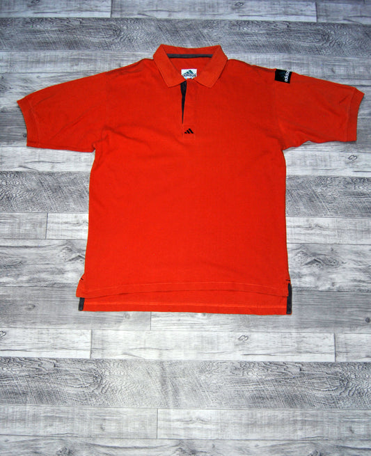 Polo Adidas de color naranja. Talla M. Segunda Mano